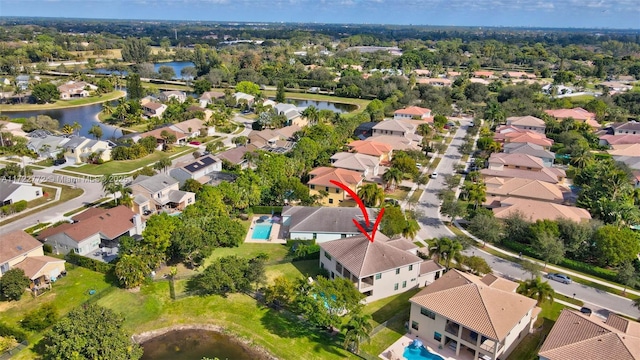 birds eye view of property featuring a water view