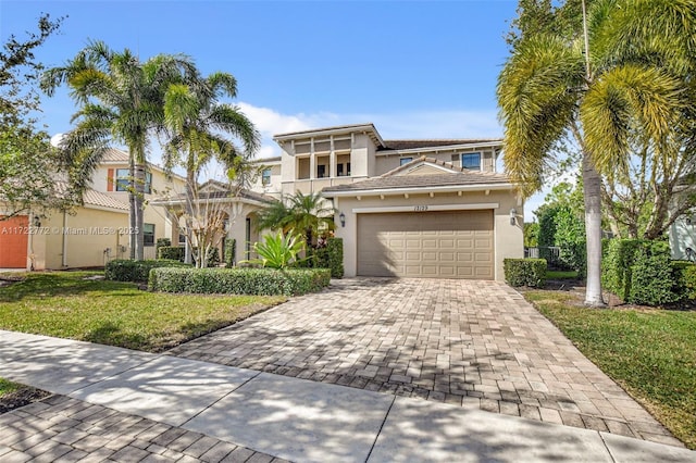 view of front of home featuring a front yard and a garage