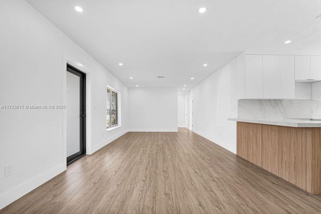 unfurnished living room featuring light hardwood / wood-style floors