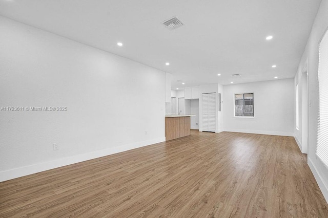 unfurnished living room with light hardwood / wood-style floors