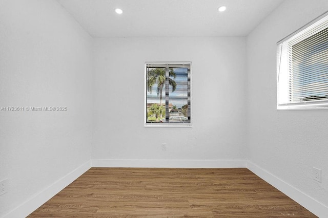 spare room featuring hardwood / wood-style flooring