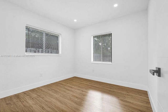 spare room featuring hardwood / wood-style flooring