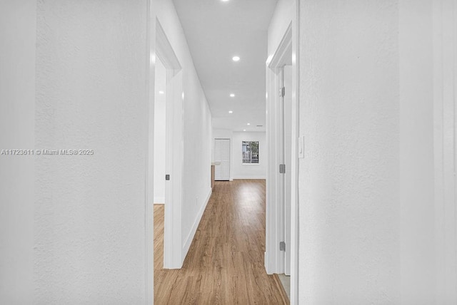 hallway with light wood-type flooring