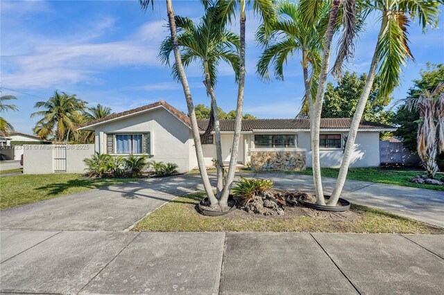5205 SW 102nd Pl, Miami, FL 33165 - single story home featuring a tile roof, concrete driveway, stucco siding, and fence
