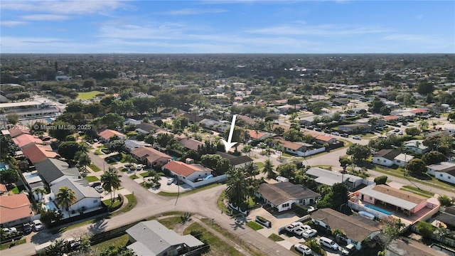 birds eye view of property with a residential view