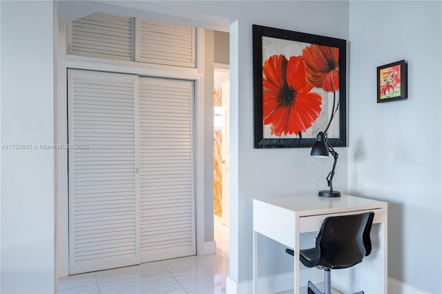 interior space featuring baseboards