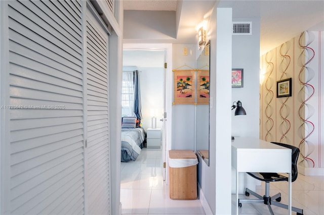 interior space featuring tile patterned flooring and visible vents