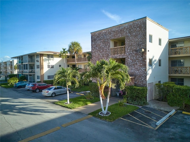 view of property with uncovered parking