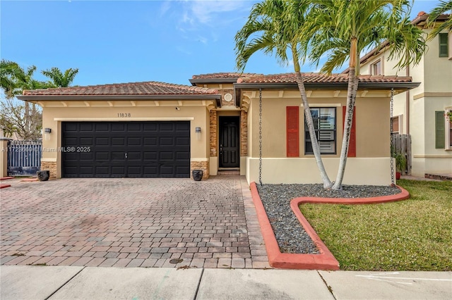 mediterranean / spanish-style home featuring a garage