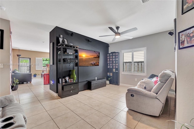 living room with light tile patterned flooring and ceiling fan