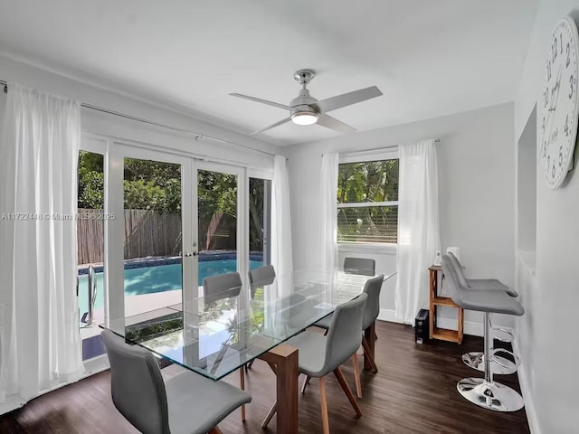 dining room with dark wood-type flooring, french doors, and ceiling fan