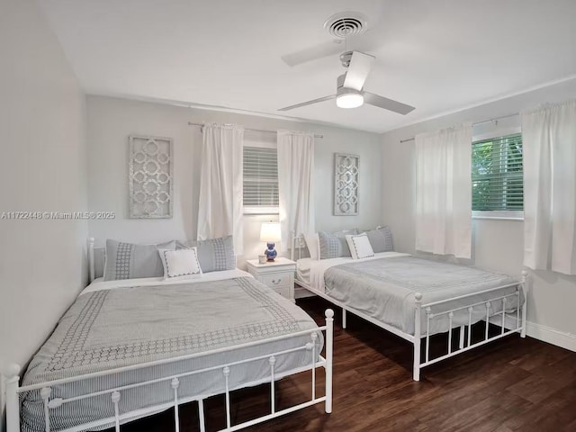 bedroom featuring ceiling fan and dark hardwood / wood-style floors