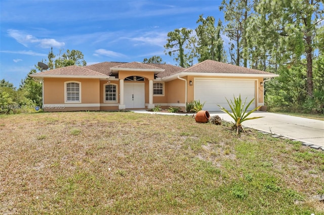 view of front of house featuring a front yard and a garage