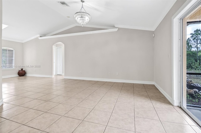 tiled empty room with an inviting chandelier, vaulted ceiling, plenty of natural light, and ornamental molding