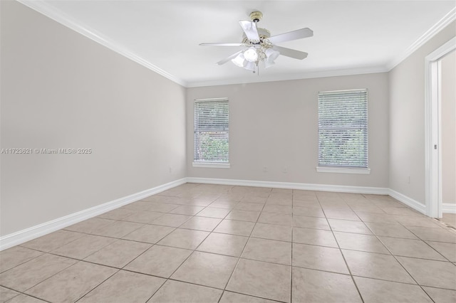 tiled empty room with ceiling fan and ornamental molding