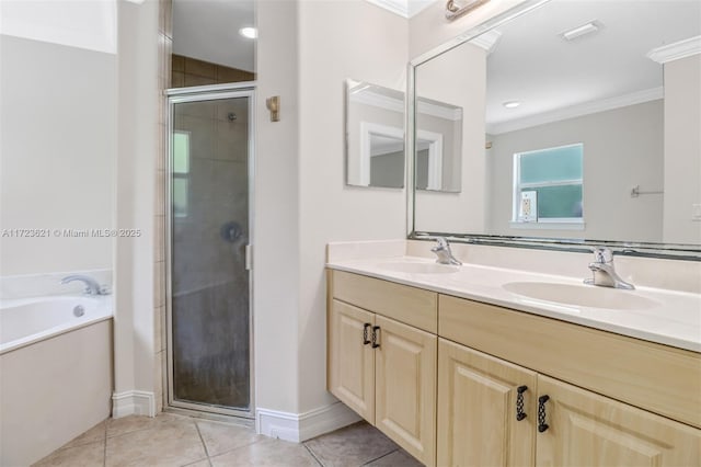 bathroom featuring tile patterned flooring, vanity, separate shower and tub, and crown molding