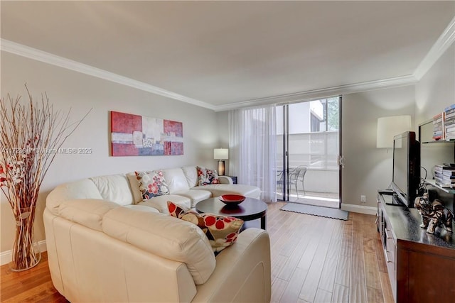 living room with light hardwood / wood-style flooring, a wall of windows, and ornamental molding