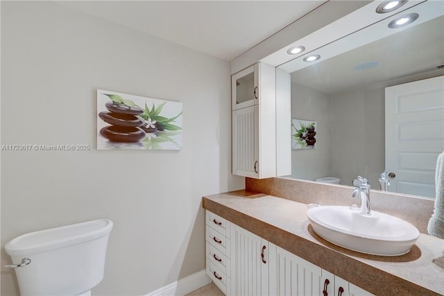 bathroom with vanity and toilet