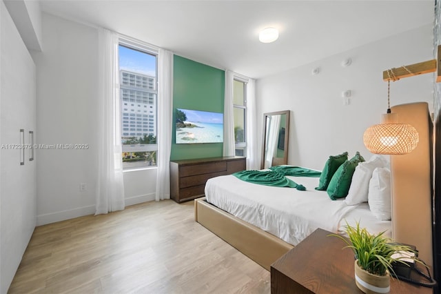 bedroom with light wood-type flooring