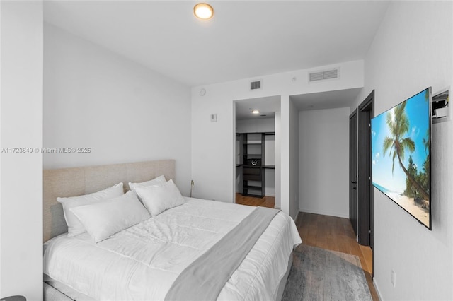 bedroom featuring hardwood / wood-style floors