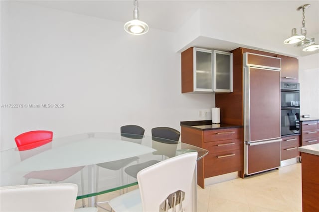 dining space featuring light tile patterned floors