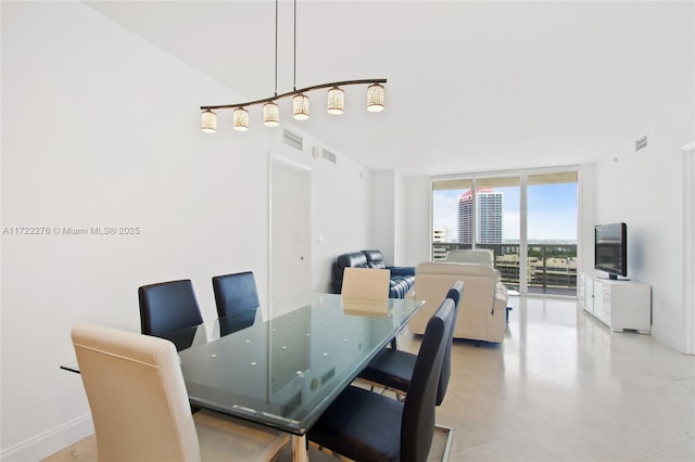 dining room with floor to ceiling windows