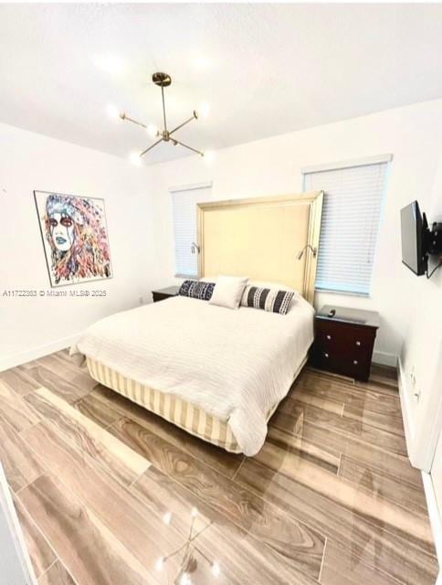 bedroom with an inviting chandelier