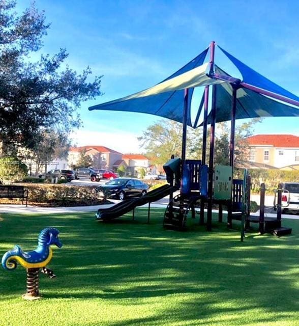 view of playground featuring a lawn