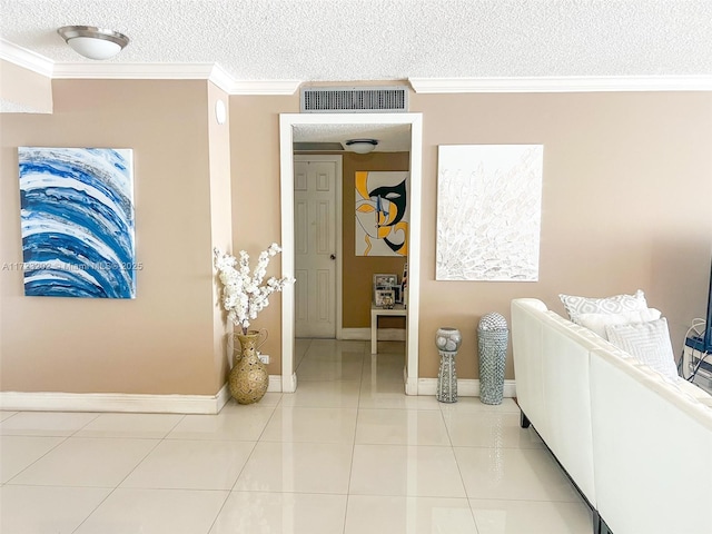 tiled bedroom with ornamental molding and a textured ceiling