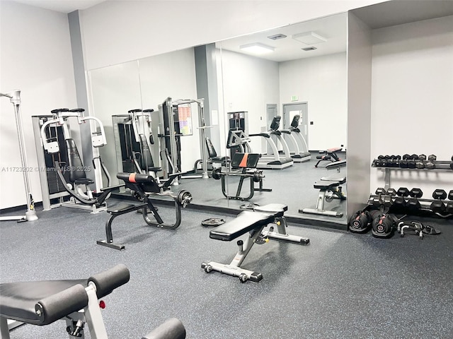 workout area featuring a high ceiling