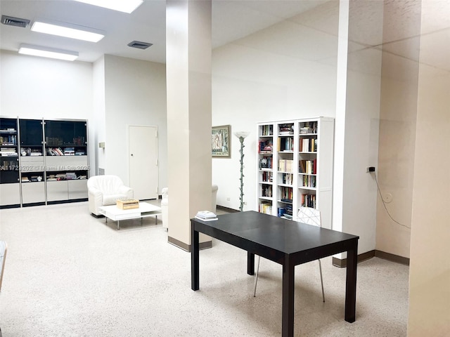 home office featuring a high ceiling