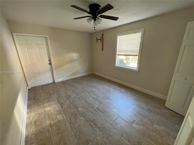 unfurnished room with ceiling fan