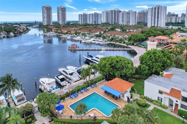 birds eye view of property with a water view