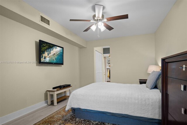 bedroom with ceiling fan and hardwood / wood-style floors