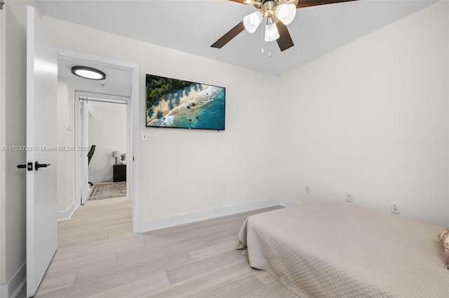 bedroom featuring ceiling fan and light hardwood / wood-style floors