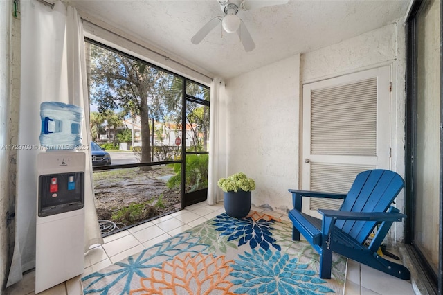 sunroom / solarium featuring ceiling fan