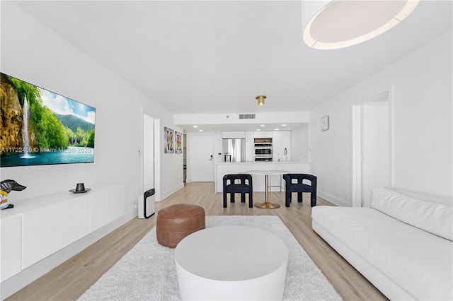 living room featuring light hardwood / wood-style floors