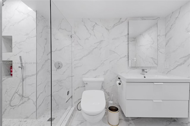 bathroom featuring tiled shower, vanity, and toilet