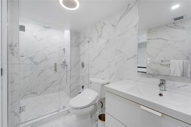 bathroom featuring vanity, toilet, walk in shower, and tile walls