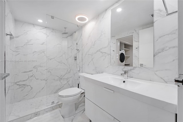 bathroom featuring walk in shower, vanity, stacked washer and clothes dryer, and toilet