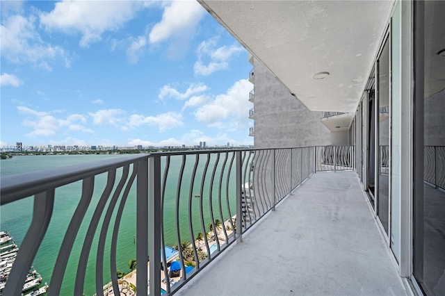 balcony featuring a water view