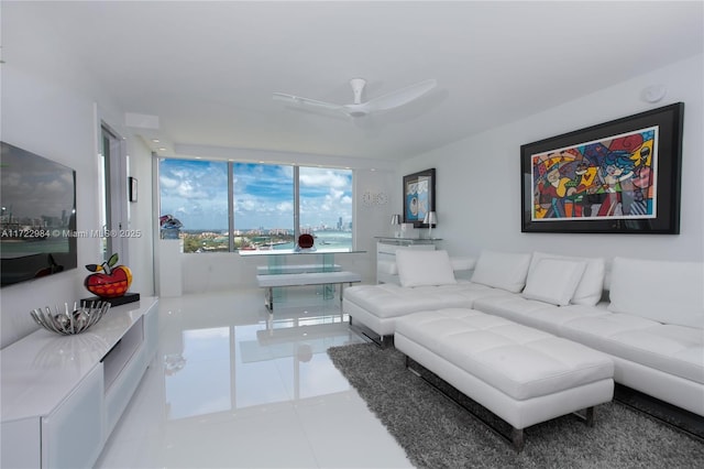 living room featuring ceiling fan and light tile patterned flooring