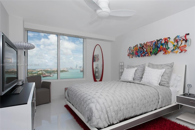 tiled bedroom featuring ceiling fan