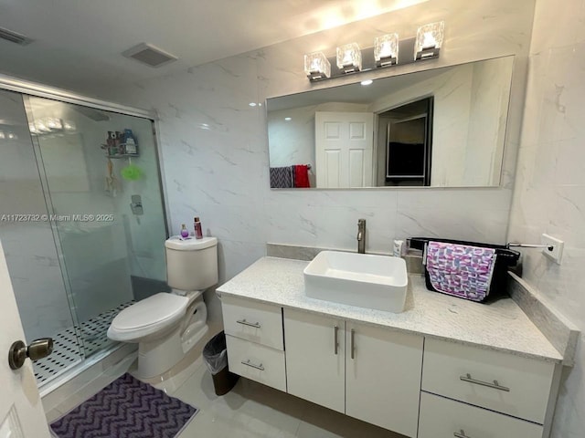 8290 Lake Dr Unit 235, Doral, FL 33166 - full bath with a stall shower, vanity, tile walls, toilet, and tile patterned floors