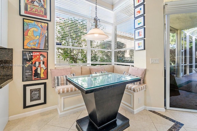 dining room with breakfast area and light tile patterned floors