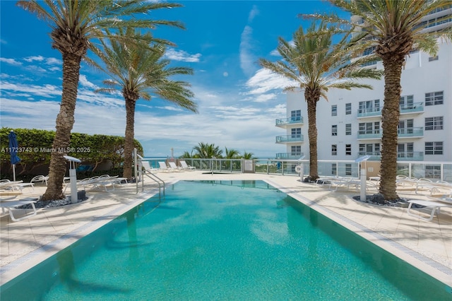 view of swimming pool featuring a patio area