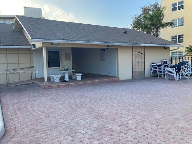 back of property with cooling unit and a patio area