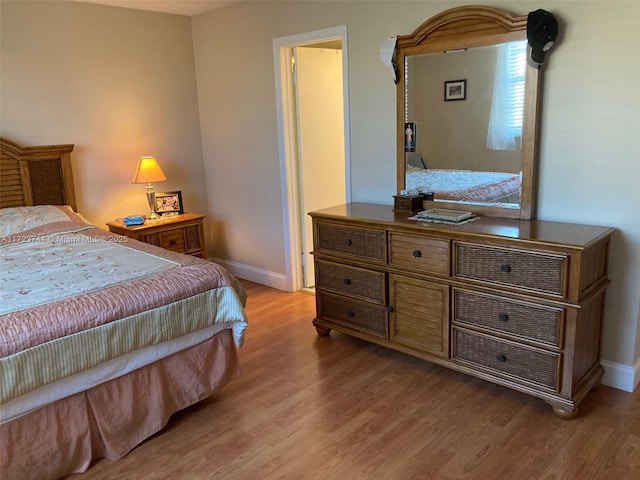 bedroom with light hardwood / wood-style floors