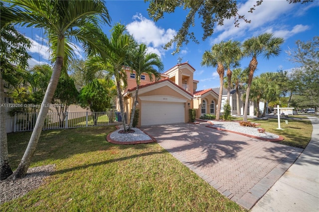 mediterranean / spanish-style house with a front lawn