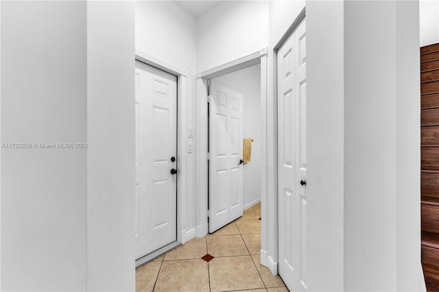 hall with light tile patterned flooring